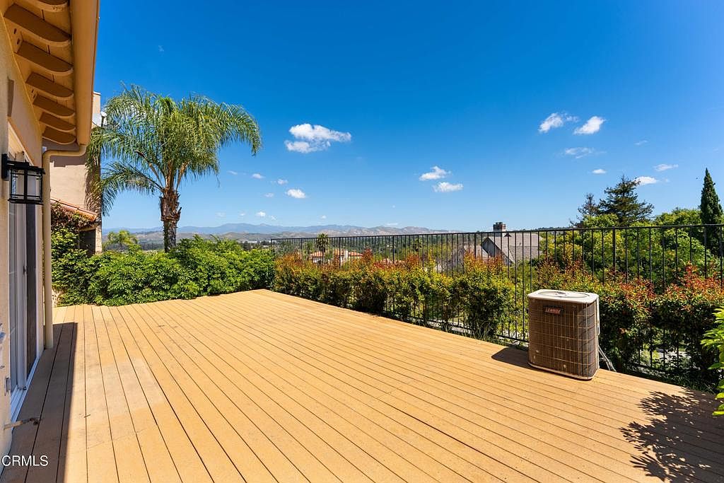 Private deck overlooking hillside mountains