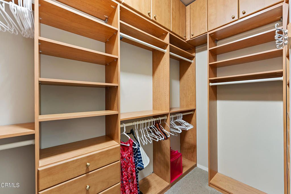 Primary ensuite bath with dual vanity and soaking tub